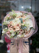 Bouquet premium color pastello con ortensie e ranuncoli